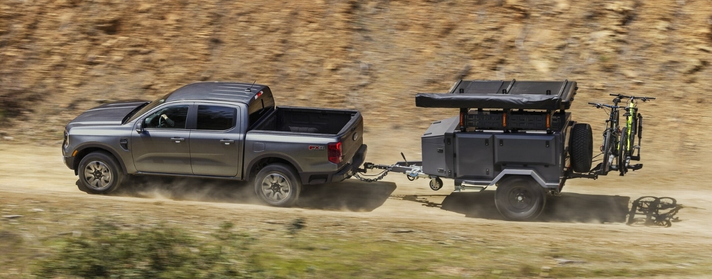 Grey 2025 Ford Ranger Lariat towing a trailer